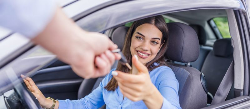 Auto business, car sale, transportation, people and ownership concept - close up of car salesman giving key to new owner or customer. Car, New, Buying.